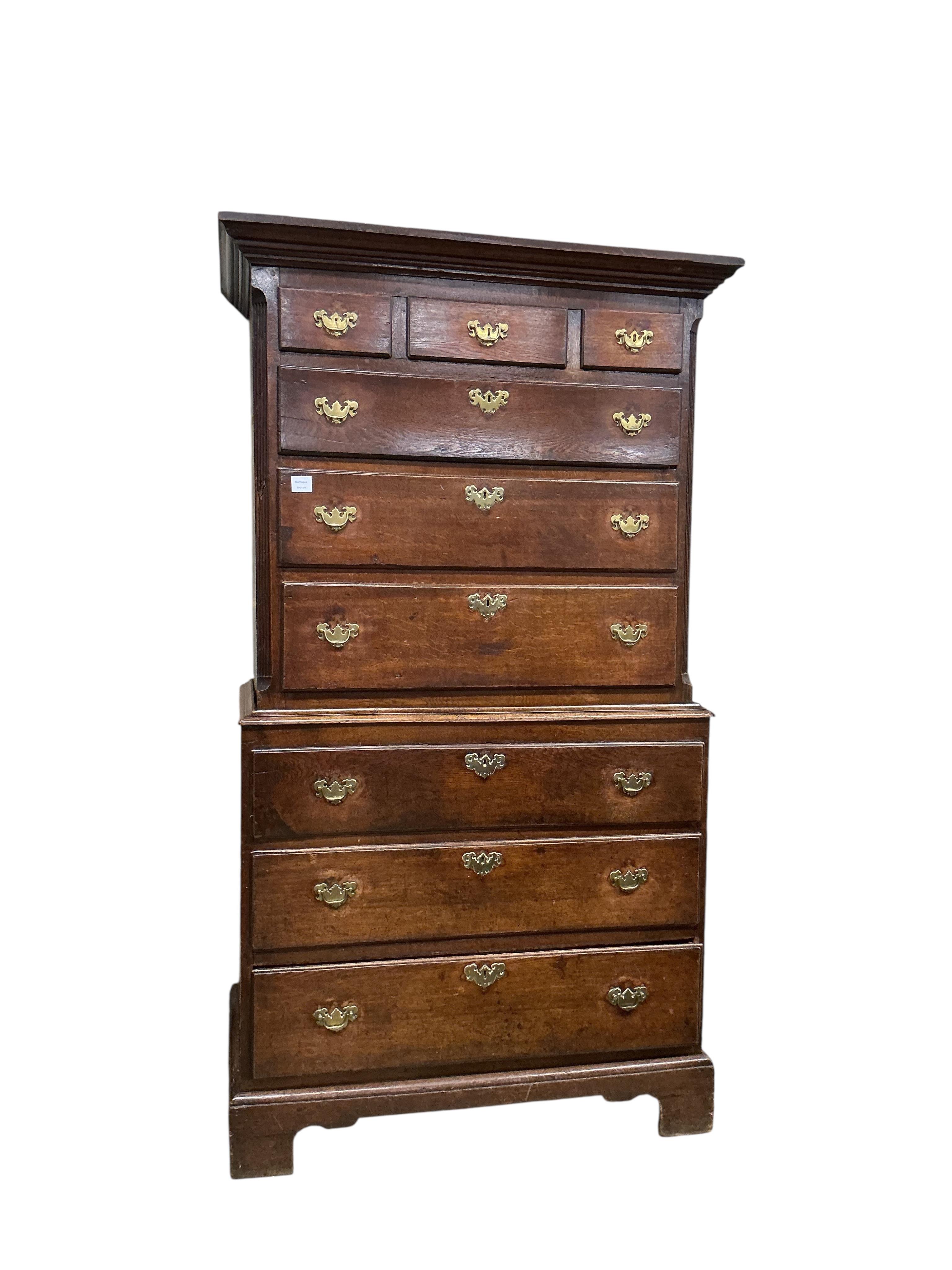 A George III oak chest on chest, width 103cm, depth 56cm, height 191cm